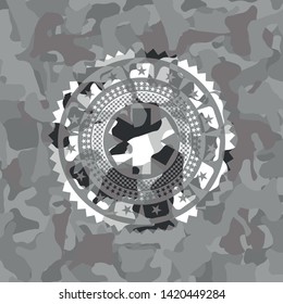 emergency cross icon inside grey camouflage texture