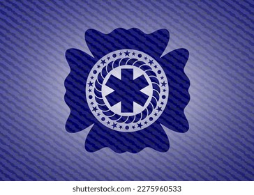 icono de cruz de emergencia dentro de jean o denim emblem o fondo de placa. 