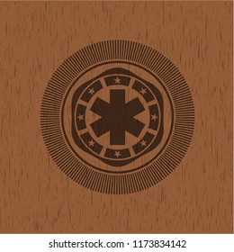 emergency cross icon inside realistic wood emblem