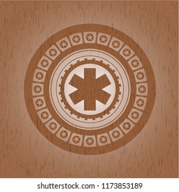 emergency cross icon inside realistic wooden emblem