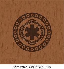 emergency cross icon inside realistic wooden emblem