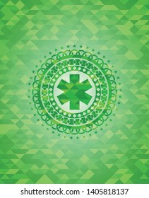 emergency cross icon inside realistic green mosaic emblem