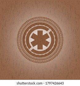 icono de cruz de emergencia dentro de un emblema de madera realista. 