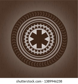 emergency cross icon inside retro wooden emblem