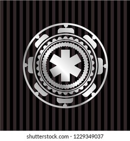 emergency cross icon inside silver emblem