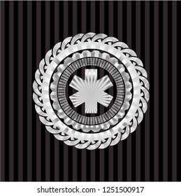 emergency cross icon inside silvery emblem or badge