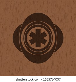 emergency cross icon inside vintage wooden emblem