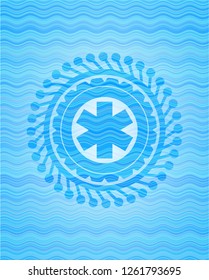 emergency cross icon inside water concept emblem background.