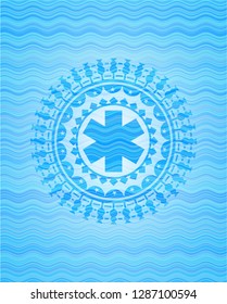 emergency cross icon inside water concept style emblem.