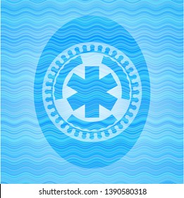 emergency cross icon inside water concept style badge.