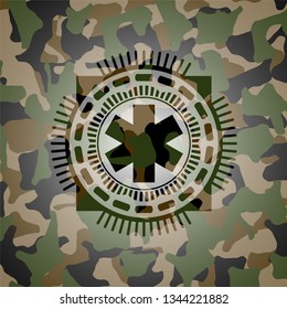 emergency cross icon on camouflaged texture