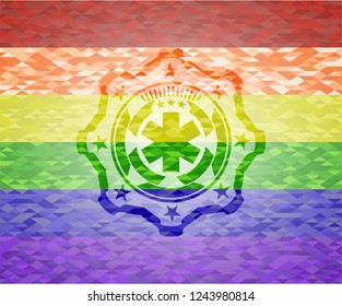 emergency cross icon on mosaic background with the colors of the LGBT flag