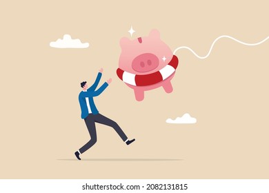 Emergency Fund Or Money To Help In Crisis Situation, Savings For Unexpected Expense Or Losing Job, Emergency Loan Concept, Happy Businessman Catching Piggybank With Lifebuoy As Life Support In Crisis.