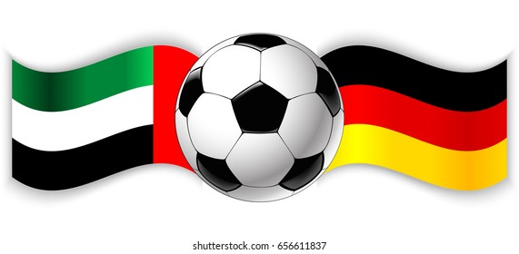 Emirian and German wavy flags with football ball. United Arab Emirates combined with Germany isolated on white. Football match or international sport competition concept.