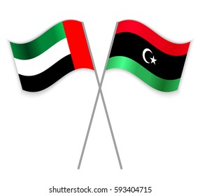 Emirian and Libyan crossed flags. United Arab Emirates combined with Libya isolated on white. Language learning, international business or travel concept.