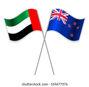Emirian and NZ crossed flags. United Arab Emirates combined with New Zealand isolated on white. Language learning, international business or travel concept.