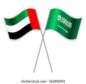 Emirian and Saudi Arabian crossed flags. United Arab Emirates combined with Saudi Arabia isolated on white. Language learning, international business or travel concept.