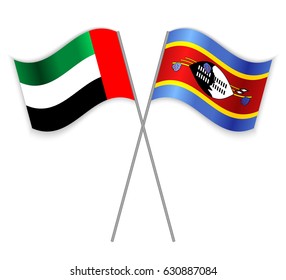 Emirian and Swazi crossed flags. United Arab Emirates combined with Swaziland isolated on white. Language learning, international business or travel concept.