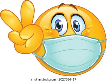 Emoji emoticon with medical mask over mouth making V sign. peace, victory or vegan gesture.