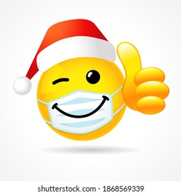 Emoji smile in medical mask showing thumb up with Santa hat. Yellow winking 3D emoticon wearing a white surgical mask. Vector illustration