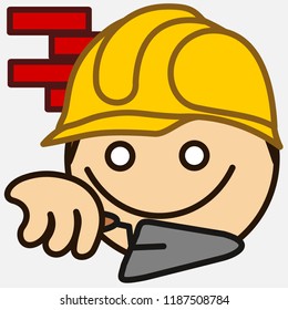 emoticon with builder that is working at the construction site in front of a brick wall wearing a safety helm or casque and holding a trowel, circle shaped vector emoji in color