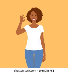 Emotions. Pretty smiling young black woman in casual clothes with hair in Afro style shows that everything is fine, ok gesture. Suitable for animation