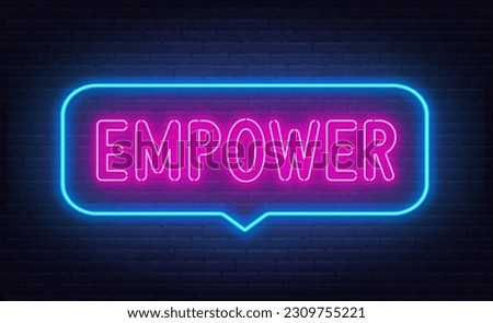 Empower neon sign in the speech bubble on brick wall background.