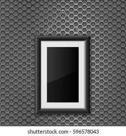 Empty black photo frame on metal perforated background. Vector 3d illustration