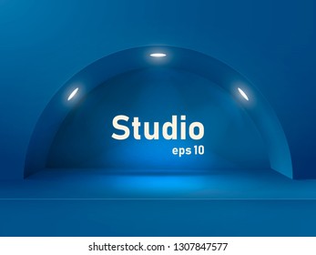 Empty blue studio table with an arch and a recess illuminated by lanterns. Free space for product presentation.