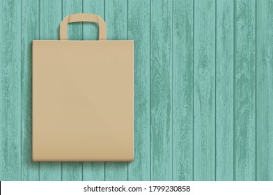 Empty brown paper bag on a wooden surface. Vector template. Mockup for advertising