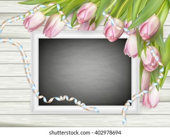 Empty clean black chalkboard with pink tulips. Top view. EPS 10 vector file included