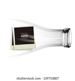empty glass bottle with a photo frame