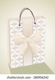 Empty glossy beige gift bag decorated with ribbons and a bow
