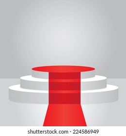 Empty illuminated podium with red carpet