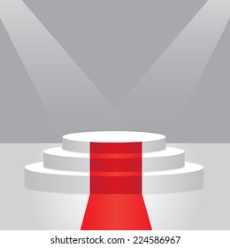 Empty illuminated podium with red carpet