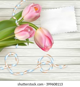 Empty note paper and tulip flowers on rustic table. EPS 10 vector file included