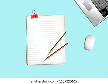 Empty notebook Red Clip Pencils and Laptop on Blue vintage background.