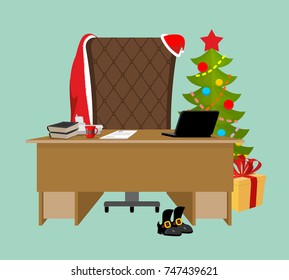 Empty Office Santa. Claus workstation. After work. Table and fir-tree. Laptop and phone. End of Christmas. Finish New Year holiday