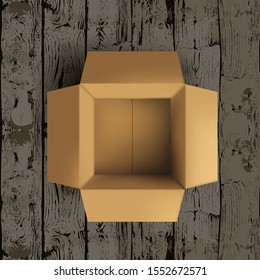 Empty Open Cardboard Box On Wooden Floor. EPS10 Vector