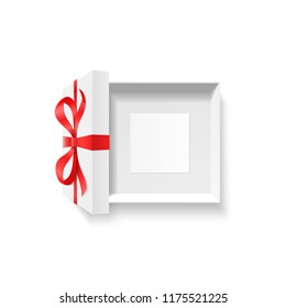 Empty open gift box, red color bow knot, ribbon with blank photo frame, greeting card inside isolated on white background. Happy birthday, Christmas or Valentine Day package concept. Vector top view