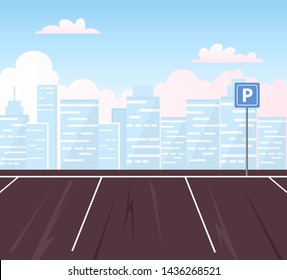 Empty parking lot with city in the background