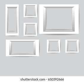 empty photo frame template set isolated on wall