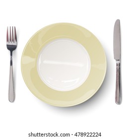 Empty plate with ivory-colored design with knife and fork isolated. View from above.
