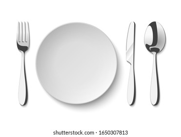 Empty plate with spoon, knife and fork. Set of isolated cutlery on a white background.