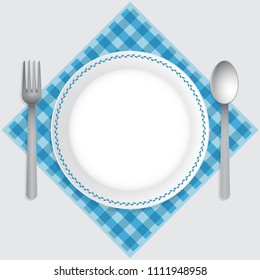 Empty plate top view, spoon and fork on a blue checkered tablecloth