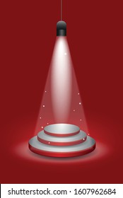 Empty podium illuminated lights on red background.