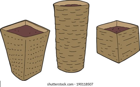 Empty rattan plant containers with soil on white background