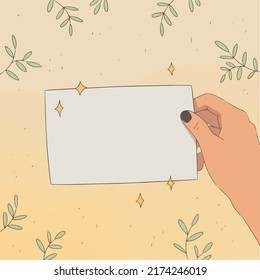 Empty sheet of paper in hand. The hand is holding a sheet of paper. Background for text.