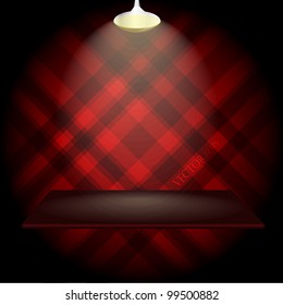 Empty shelf on red wall