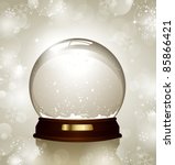 empty snowglobe against a bright defocused background with glittering lights and snowflakes - customize by inserting your own object!